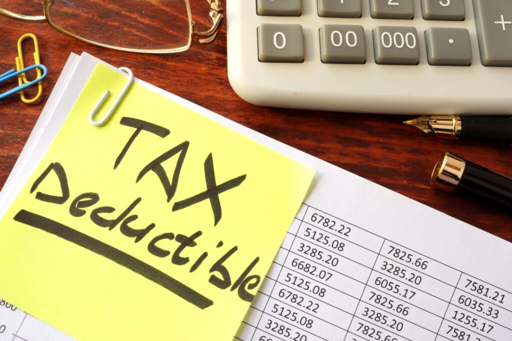 accounts page with a post it note attached saying tax deductible
